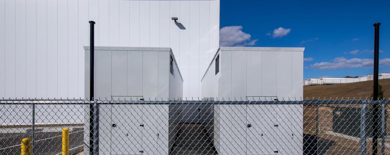 Industrial arbitrary waveform generators installed outside a commercial facility